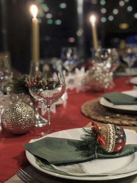 A fancy dinner table decorated for chritsmas