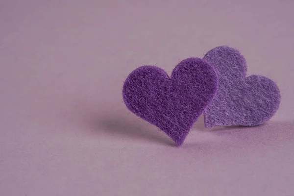 hearts on a purple background with copy space