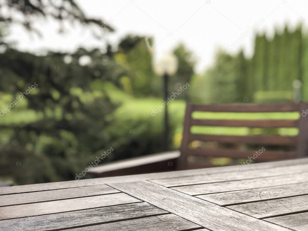 wooden table and chair at a garden