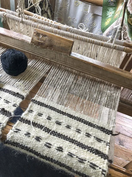 black skein on a manual carpet loom