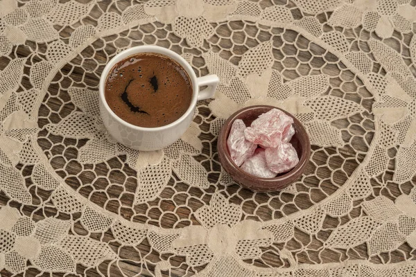 Coffee and turkish delights on table covered with lace — Stock Photo, Image