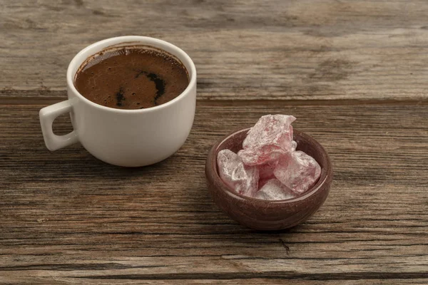Coffee and turkish delight on a wooden table with copy space — Stock Photo, Image