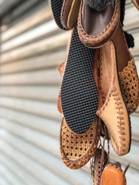 handmade leather shoes hanged in the bazaar in Turkey