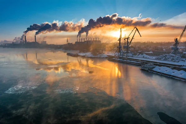 Big industrial plant on lake shoreline