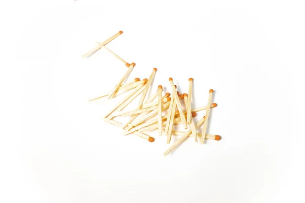 A pile of wooden matches on white background