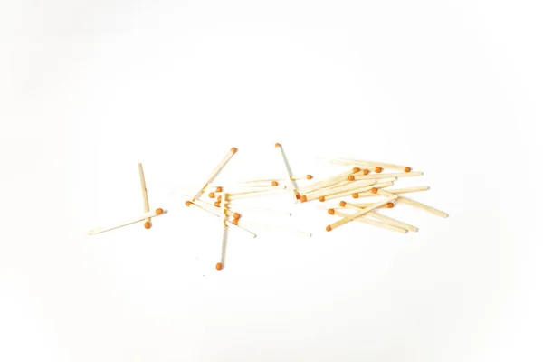 A pile of wooden matches on white background