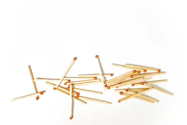 A pile of wooden matches on white background