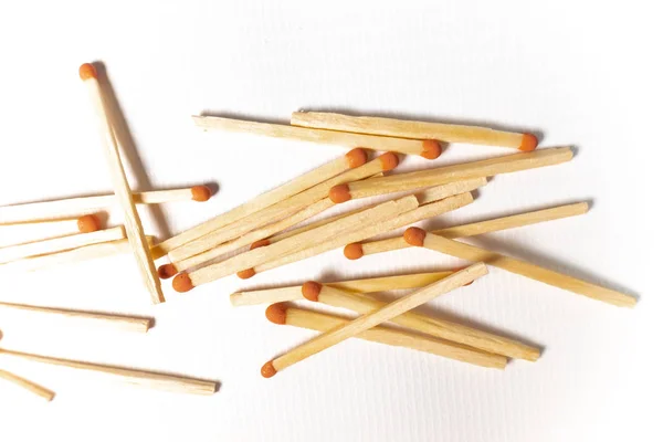 A pile of wooden matches on white background