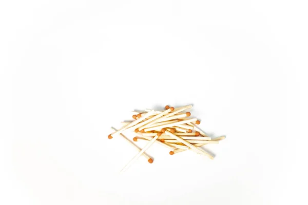 A pile of wooden matches on white background