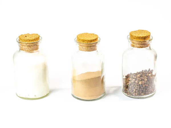 Different Spices Glass Bottles White Background — Stock Photo, Image