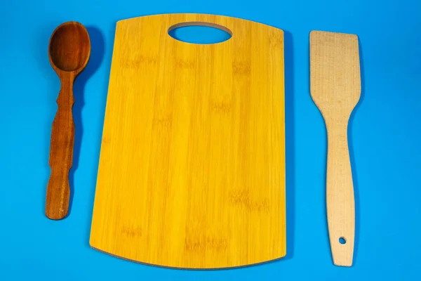 wooden chopping board,  kitchen utensils
