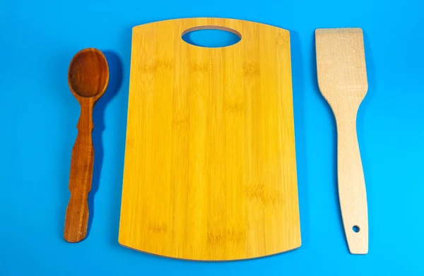 wooden chopping board,  kitchen utensils