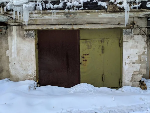 old metal garage doors in winter
