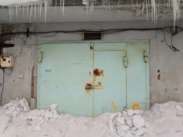 old metal garage doors in winter