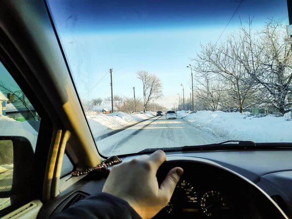 driving in a car on a winter road, winter road, inside a car, a lot of snow