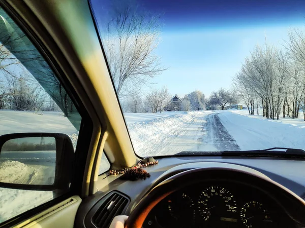 driving in a car on a winter road, winter road, inside a car, a lot of snow