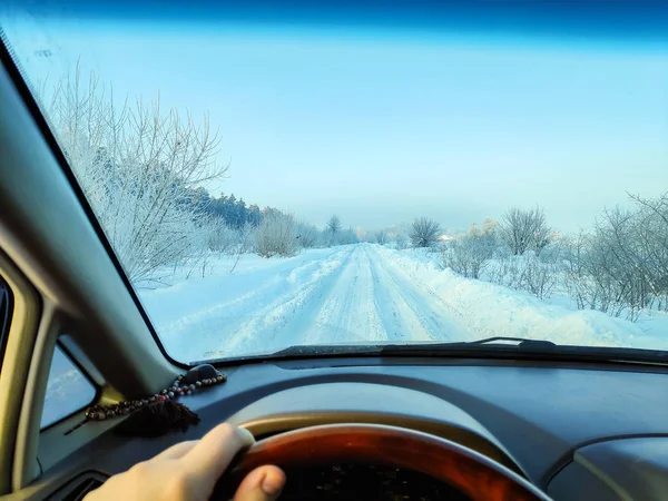 driving in a car on a winter road, winter road, inside a car, a lot of snow