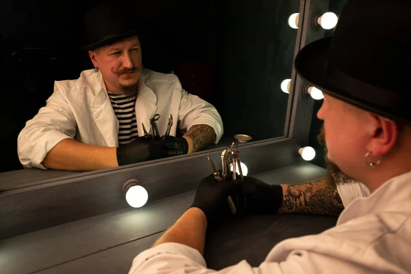 reflection in the mirror man, portrait of a man in a hat with a mustache and beard