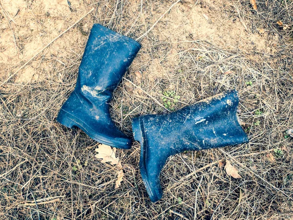 Big Black Boots Thrown Shoes Rubber Boots — Stock Photo, Image