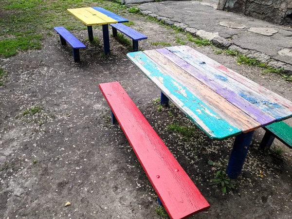 colored wooden furniture, street benches and table, children\'s furniture