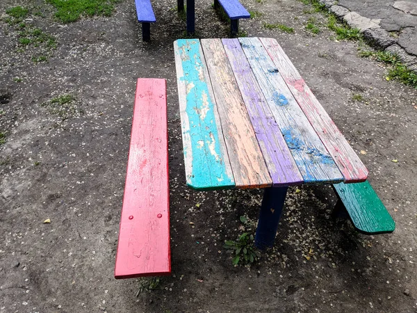 colored wooden furniture, street benches and table, children\'s furniture