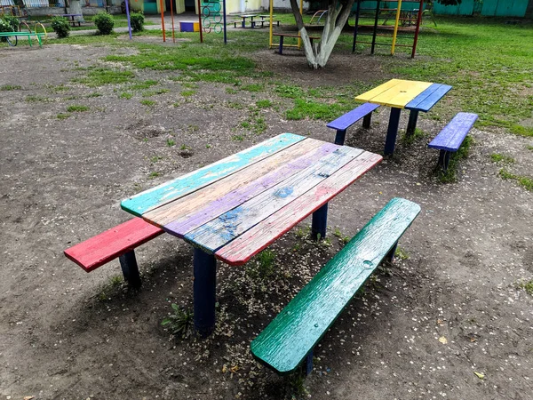 colored wooden furniture, street benches and table, children\'s furniture