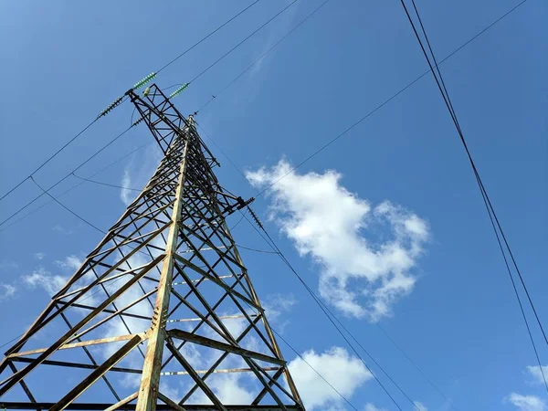 mast high-voltage lines. high voltage wires on poles.