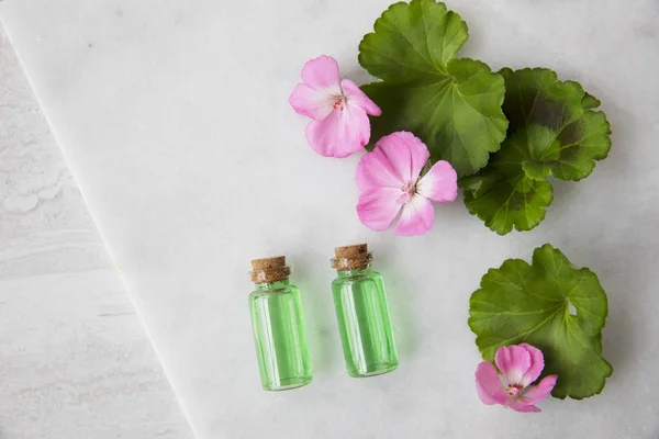 Plant Extract and Geraniums Flat Lay