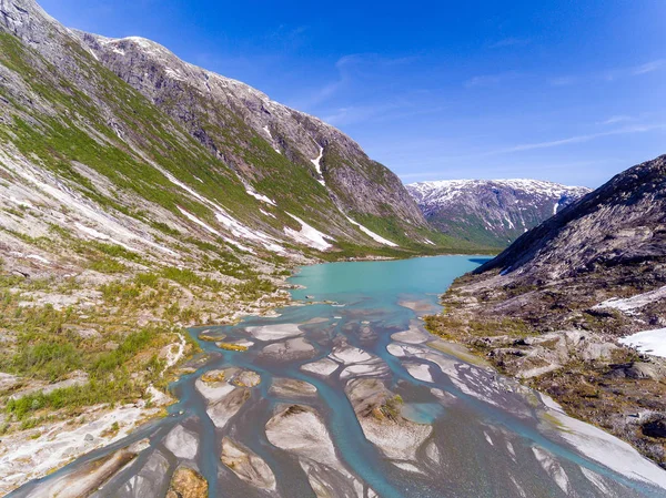 Nigardsbreen buzul Nigardsvatnet Jostedalsbreen Ulusal parkında güneşli bir Norveç'te yakınındaki havadan görünümü