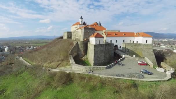 Beautiful aerial view to Palanok Castle at day and the city of Mukachevo — Stock Video