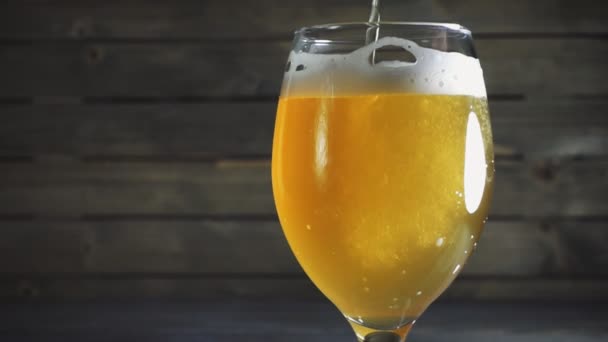 Pouring light beer into glass. — Stock Video