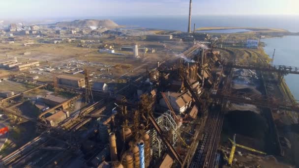 Aerial view over dirty smoke and smog from pipes of steel factory and blast furnaces. industrialized city, pollution from metallurgical plant. Ecological — Stock Video