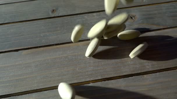 Medical pills poured on the table, in slow motion — Stock Video