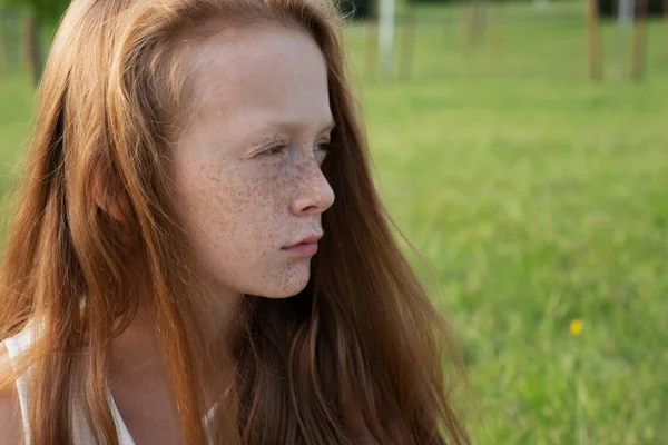 Beautiful sad little girl looks into distance Royalty Free Stock Photos