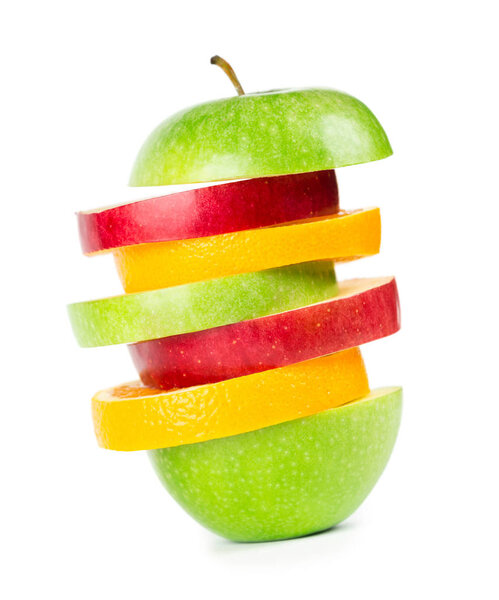 Fruit slices. Stack of mixed fruit on white background. Orange and apple