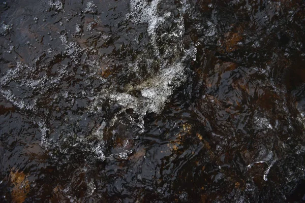 A raging stream of water in a swift stream.