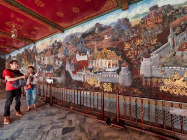Bangkok, Thailand, 3rd January 2019, The Grand Palace is the must see attraction in Bangkok. Tourists admire the beautiful wall murals at  the dazzling, spectacular Grand Palace, home of the Thai King.