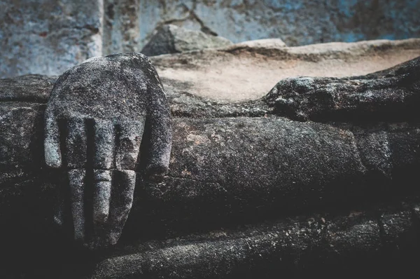 Close up of Buddha statue hand at Ayutthaya, ancient city in Thailand