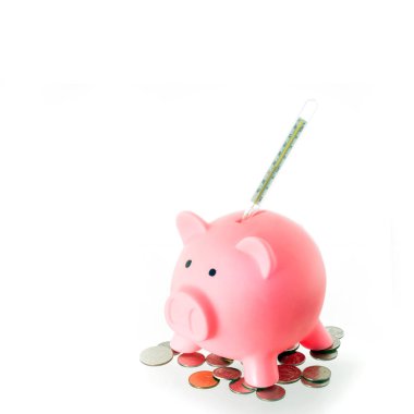pink piggy bank with coins and thermometer on white background clipart
