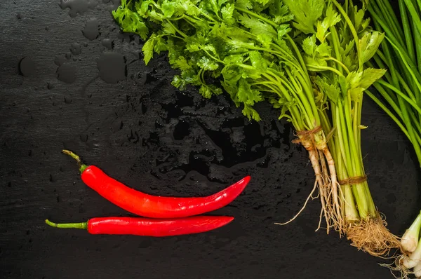 Set Red Chili Peppers Greens Black Background — Stock Photo, Image