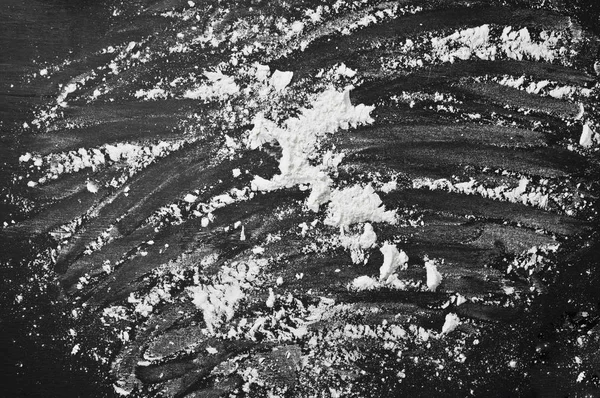 smeared out flour on black background