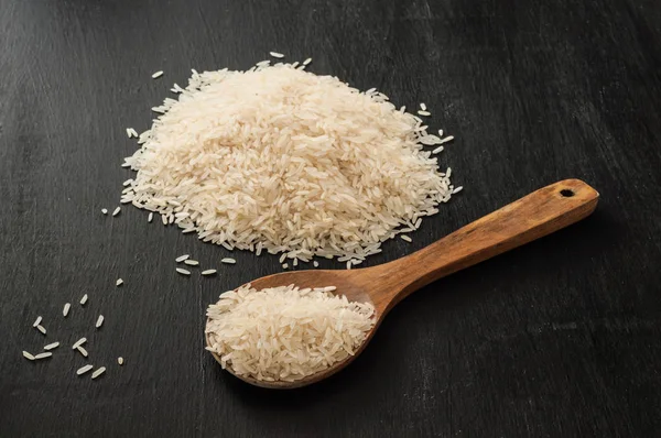 White Rice Wooden Spoon Black Background Royalty Free Stock Images