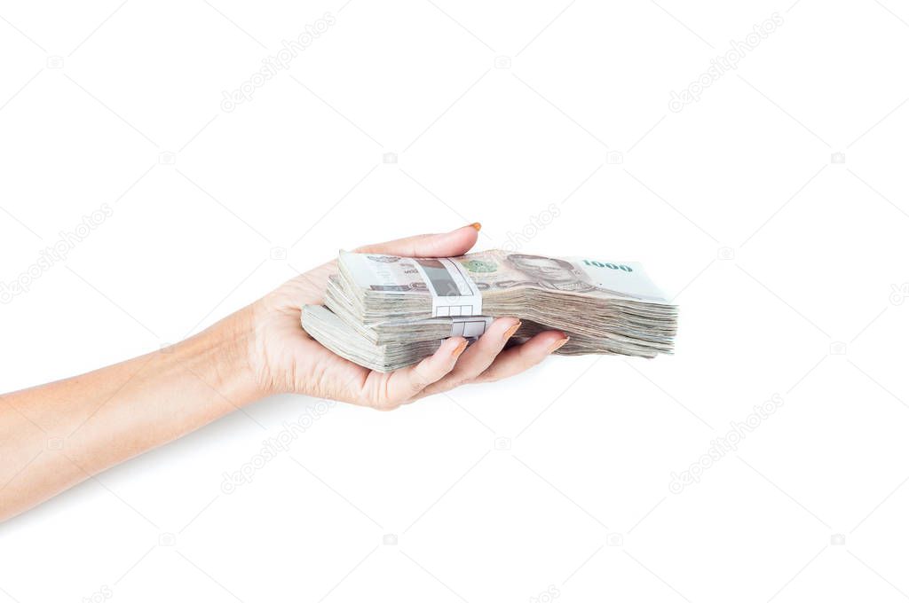 female hand holding money stacks on white background 