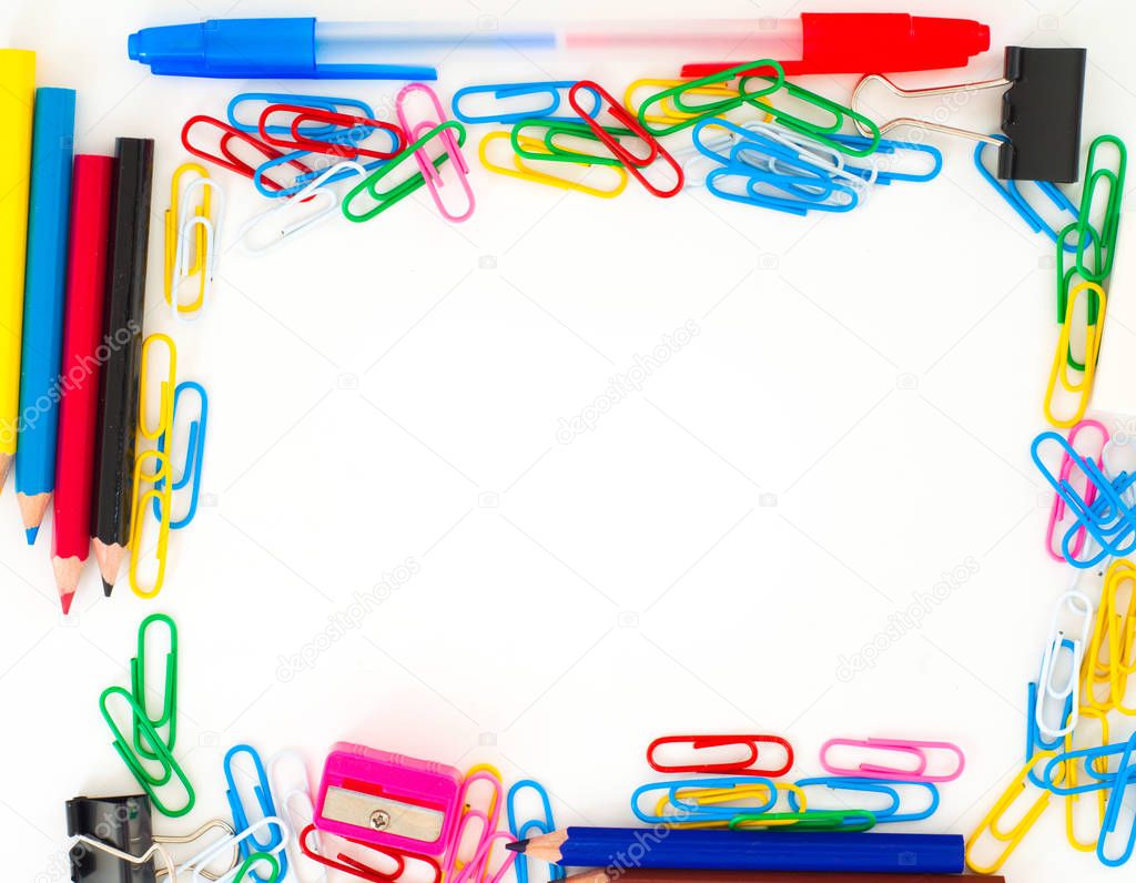 Frame from different school supplies with copy space on white background 