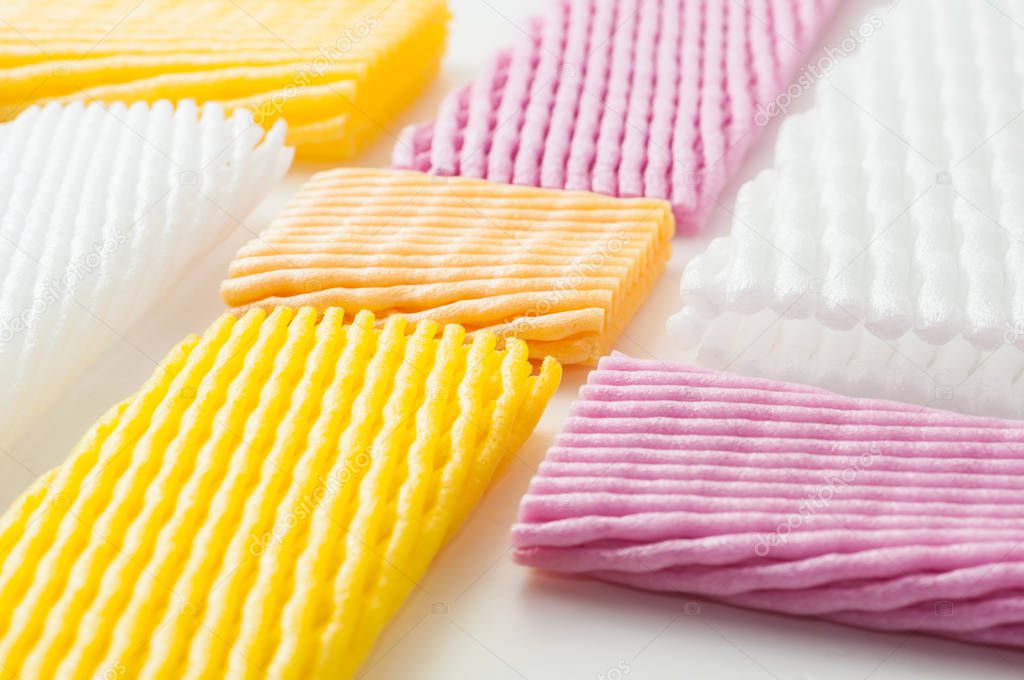 colorful packaging nets for fruits on white background