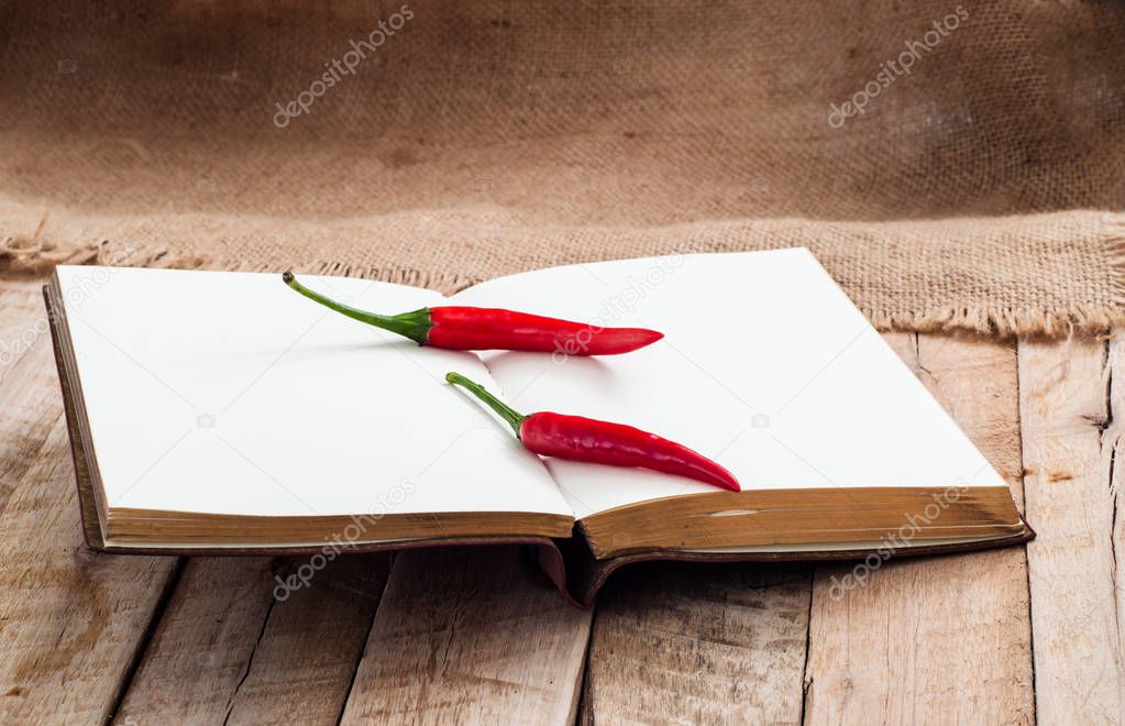 red peppers on opened empty diary