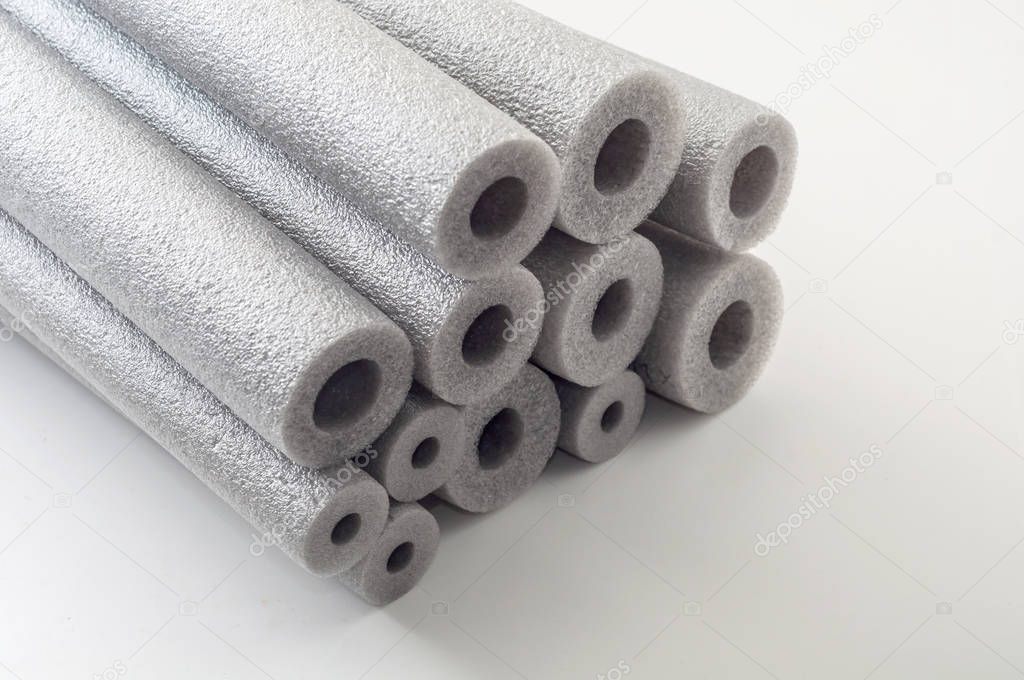 equipment for thermal insulation of pipes on white background