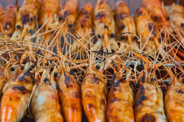 cooked shrimps in grid after grill