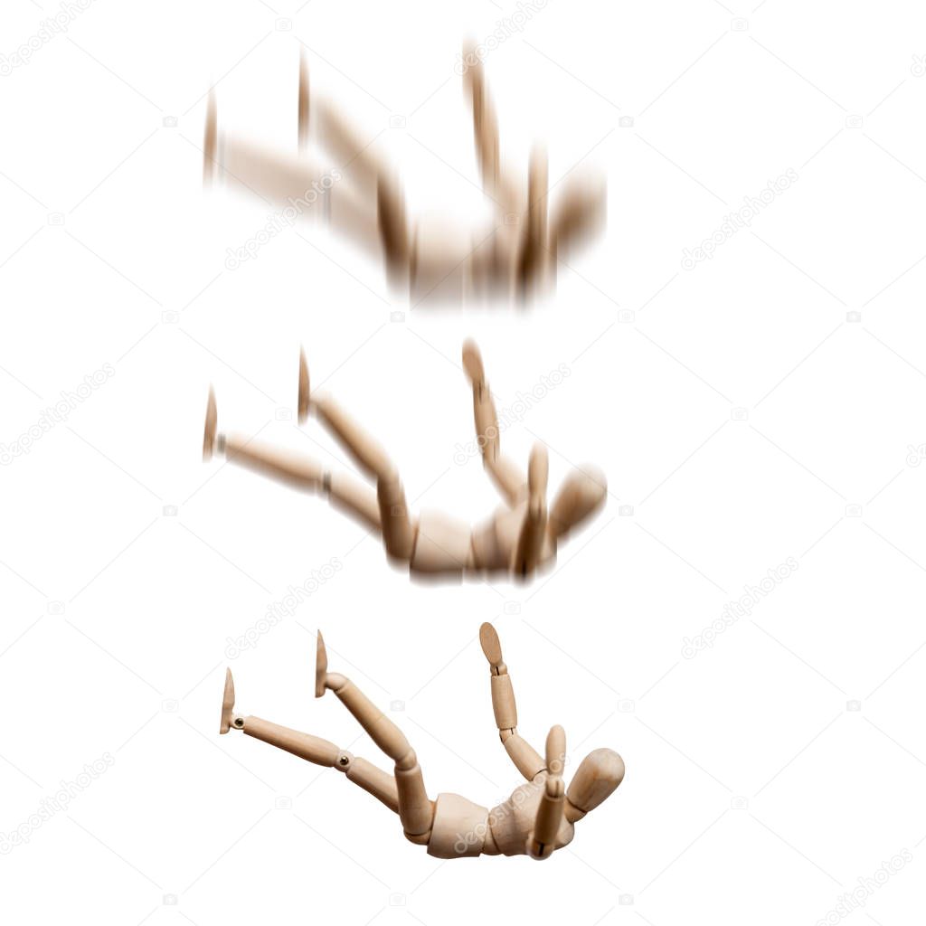 Falling wooden mannequins on white background 