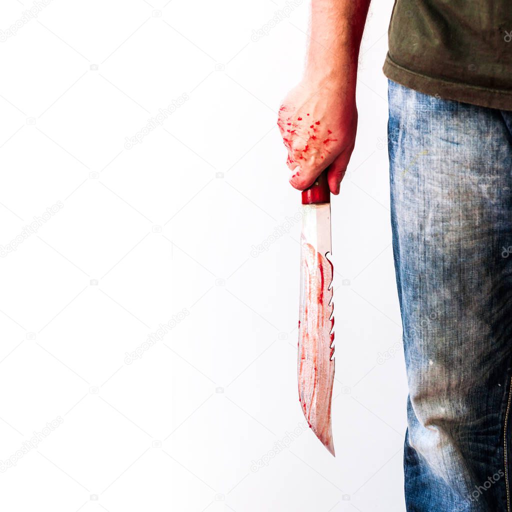 close up of male hand holding bloody knife